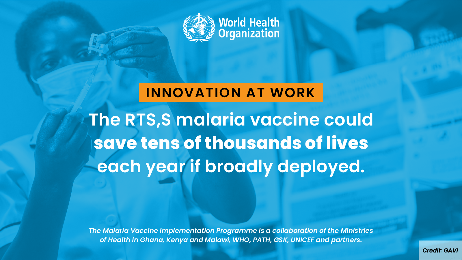 An African woman in the background administering a vaccine.